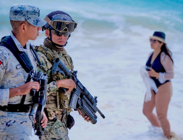 Americans in vacation hot spot may see more military than margaritas this summer