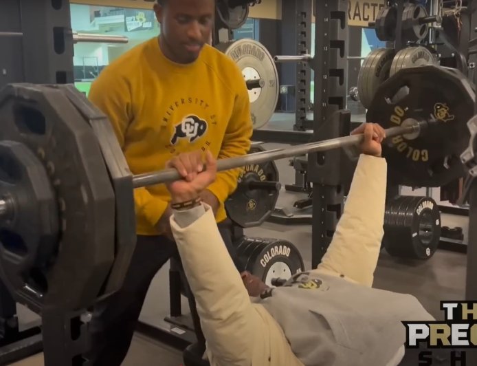 Deion Sanders casually benched 245 pounds in winter coat and chains without warming up after medical scare