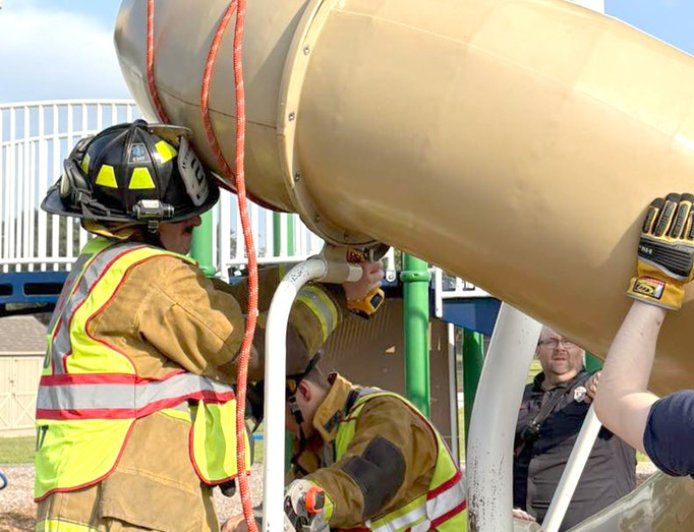 Firefighters cut open playground slide to rescue 40-year-old man stuck inside