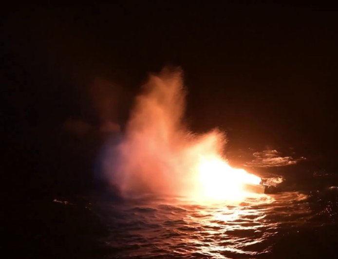 Coast Guard burns, sinks suspected 'drug boat,' apprehends 7 alleged drug smugglers: video
