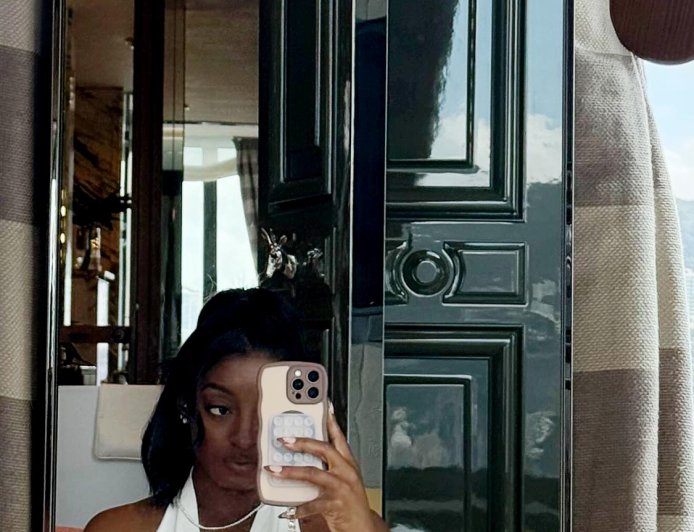 Simone Biles Shows Off Abs and Belly Button Piercing in Crop Top and Pants