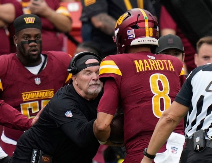 Commanders' Dan Quinn left bloodied after quarterback runs into him during play