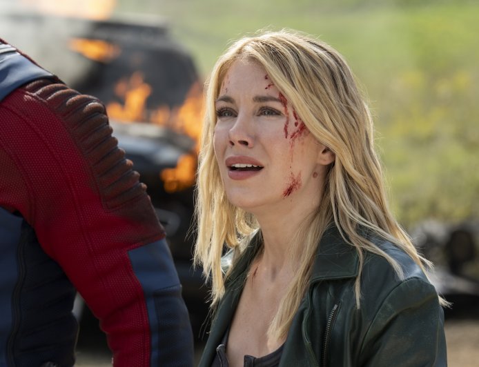 ‘Peacemaker’ Star Jennifer Holland On Harcourt’s Romantic Journey and the ‘Fun’ of Her Fight Scenes: ‘I Got to Throw “Mein Kampf” at a Nazi’s Face’