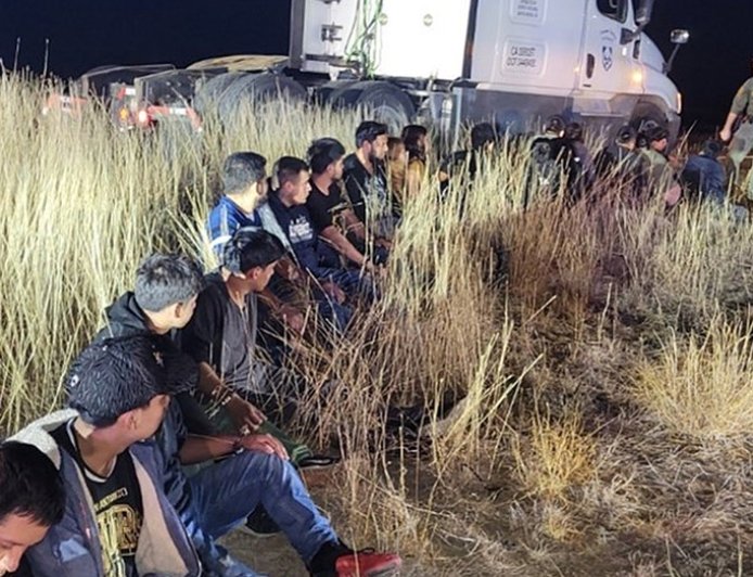Video shows 23 illegal immigrants found hidden in truck cab during tense traffic stop: police