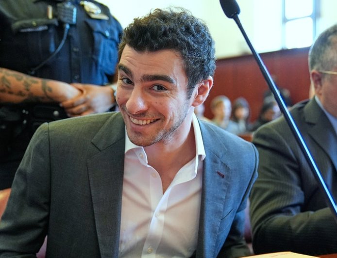 Luigi Mangione smiles for cameras in court as defense claims police violated his rights