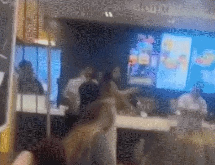 McDonald's customer caught on camera launching flying kick at employee during heated brawl