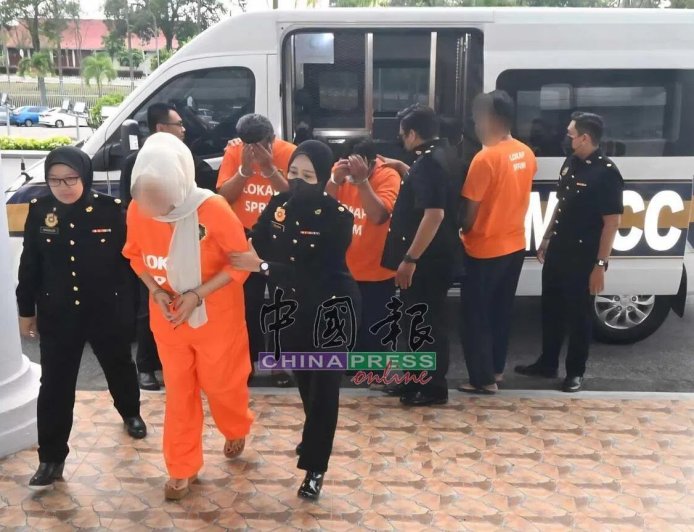 15年涉收“保护费”逾百万令吉 马国三移民局官员被控